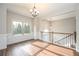 Bright room boasting wood-look floors, wainscoting, and a large window providing ample natural light at 5995 Crowley Dr, Douglasville, GA 30135