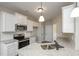 Kitchen featuring white cabinets, granite countertops and stainless steel appliances at 5995 Crowley Dr, Douglasville, GA 30135