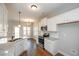 Bright kitchen with granite countertops, stainless appliances, and a view of the dining area at 5995 Crowley Dr, Douglasville, GA 30135
