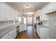 Bright kitchen with white cabinets, granite countertops and stainless steel appliances at 5995 Crowley Dr, Douglasville, GA 30135
