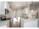 Spacious kitchen with granite countertops, stainless appliances, and a view of the living area at 5995 Crowley Dr, Douglasville, GA 30135