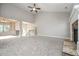 Spacious living room with fireplace, vaulted ceilings, carpet, and an open view of the entryway at 5995 Crowley Dr, Douglasville, GA 30135