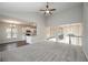 Living area featuring vaulted ceilings, plush carpeting, a fireplace, with view of the kitchen and entryway at 5995 Crowley Dr, Douglasville, GA 30135