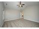 Spacious main bedroom with vaulted ceiling, ceiling fan, carpeted floor, and natural light at 5995 Crowley Dr, Douglasville, GA 30135