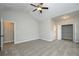 Spacious main bedroom featuring a ceiling fan, walk-in closet, and vaulted ceiling at 5995 Crowley Dr, Douglasville, GA 30135