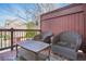 Balcony featuring two rocking chairs, a small table and a view of the neighborhood and street at 928 Boudreau Ct, Atlanta, GA 30328