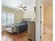 Cozy bedroom has wood floors, a ceiling fan and ensuite bathroom at 928 Boudreau Ct, Atlanta, GA 30328