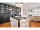 Elegant dining area features a modern chandelier, wine storage, and access to the light-filled living room at 928 Boudreau Ct, Atlanta, GA 30328
