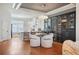 Open-concept living with eat-in kitchen, dining, and wine storage with stainless hardware and wooden flooring at 928 Boudreau Ct, Atlanta, GA 30328