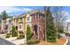 Charming brick townhome with manicured landscaping and attached garage in a friendly neighborhood at 928 Boudreau Ct, Atlanta, GA 30328