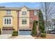 Attractive brick townhome showcasing a private garage and well-maintained landscaping at 928 Boudreau Ct, Atlanta, GA 30328