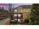 Townhome exterior with brick and siding, mature trees, two balconies and well-maintained landscaping at 928 Boudreau Ct, Atlanta, GA 30328