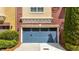 Close-up of a well-maintained, stylish blue garage door with decorative hardware at 928 Boudreau Ct, Atlanta, GA 30328