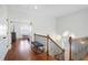 Hallway with hardwood floors, white walls, and a staircase at 928 Boudreau Ct, Atlanta, GA 30328
