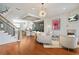 Open-concept interior showcases wooden floors, elegant furniture, a staircase, and an eat-in kitchen at 928 Boudreau Ct, Atlanta, GA 30328