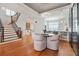 Open-concept floor plan showcasing staircase, kitchen with breakfast bar, and elegant dining area at 928 Boudreau Ct, Atlanta, GA 30328