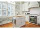 Bright, modern kitchen features white cabinets, stainless steel appliances, and a butcher block island at 928 Boudreau Ct, Atlanta, GA 30328
