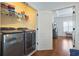 Bright laundry room features front load washer and dryer, wire rack shelving and adjoins the main bedroom at 928 Boudreau Ct, Atlanta, GA 30328