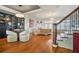 Spacious living room features hardwood floors, a fireplace, modern lighting and decor, open floor plan at 928 Boudreau Ct, Atlanta, GA 30328