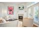 Living room features a fireplace, mantle, television, access to the outside, and elegant neutral decor at 928 Boudreau Ct, Atlanta, GA 30328
