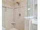 The tiled shower features a corner seat and glass enclosure at 928 Boudreau Ct, Atlanta, GA 30328