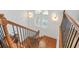 Staircase with wood railings and treads, with a shuttered window to provide natural light at 928 Boudreau Ct, Atlanta, GA 30328