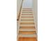 Carpet free staircase featuring hardwood treads and handrail, white risers and base trim at 928 Boudreau Ct, Atlanta, GA 30328
