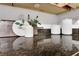 An image showing a countertop with white ceramic decorations, a cutting board and a dark marble countertop at 1468 Briarwood Ne Rd # 502, Brookhaven, GA 30319