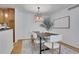 Bright dining room with a wooden table, six chairs, and decorative chandelier at 1468 Briarwood Ne Rd # 502, Brookhaven, GA 30319