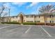 Apartment building exterior with well-maintained landscaping and ample parking spaces at 1468 Briarwood Ne Rd # 502, Brookhaven, GA 30319