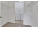 Walk-in laundry room with white washer and dryer units and wire shelving at 1468 Briarwood Ne Rd # 502, Brookhaven, GA 30319