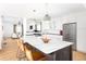 Bright open kitchen featuring an island with marble countertop, modern lighting and stainless steel appliances at 218 Garland Ave, Decatur, GA 30030