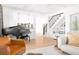 Elegant living room with piano, staircase, and built-in shelving; bathed in natural light at 218 Garland Ave, Decatur, GA 30030