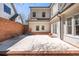 Spacious outdoor patio with brick accents and view of the home's architectural details at 218 Garland Ave, Decatur, GA 30030