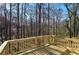 Newly constructed wooden back deck overlooking a lush wooded lot providing privacy and a peaceful retreat at 63 Colette Ct, Douglasville, GA 30134