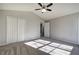 Spacious bedroom with vaulted ceiling, ceiling fan, closet, and neutral carpet at 63 Colette Ct, Douglasville, GA 30134