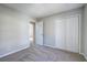 Bedroom featuring neutral carpet and double door closet at 63 Colette Ct, Douglasville, GA 30134