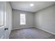 Bedroom featuring neutral carpet and natural lighting at 63 Colette Ct, Douglasville, GA 30134