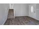 Entryway with hardwood floors, staircase, and white front door at 63 Colette Ct, Douglasville, GA 30134