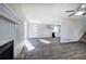 Bright and airy living room featuring a fireplace, hardwood floors and stairs to the second level at 63 Colette Ct, Douglasville, GA 30134