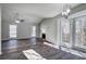 Bright living room with fireplace, bay window, and ceiling fan at 63 Colette Ct, Douglasville, GA 30134