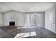 Bright living room with fireplace, bay window, and modern light fixture at 63 Colette Ct, Douglasville, GA 30134