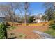 Large backyard with a wooden fence and walking trail at 1328 Briarwood Ne Dr, Atlanta, GA 30306