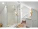 Contemporary bathroom featuring a glass-enclosed shower, white tile, and modern fixtures at 1328 Briarwood Ne Dr, Atlanta, GA 30306