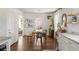 Bright dining room with wood floors, white walls, and modern light fixture at 1328 Briarwood Ne Dr, Atlanta, GA 30306