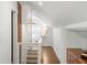 Hallway with railing, and hardwood floors, leading to a bath at 1328 Briarwood Ne Dr, Atlanta, GA 30306