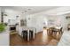 Open kitchen flowing into dining area, featuring a marble island with barstool seating at 1328 Briarwood Ne Dr, Atlanta, GA 30306