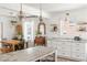 Open concept kitchen with marble countertops, a kitchen island, and hardwood floors at 1328 Briarwood Ne Dr, Atlanta, GA 30306