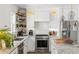 Close-up of kitchen featuring a subway tile backsplash, stainless steel appliances, and modern fixtures at 1328 Briarwood Ne Dr, Atlanta, GA 30306