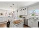 Bright kitchen with island and marble countertops, providing seating and prep space at 1328 Briarwood Ne Dr, Atlanta, GA 30306